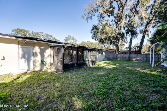 view of yard featuring a sunroom