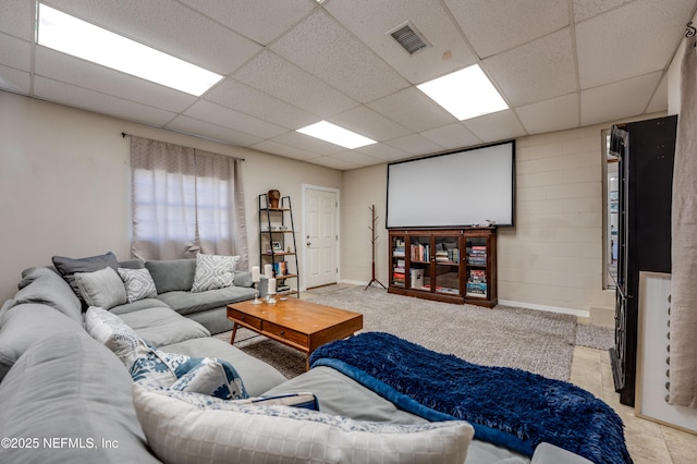 living room featuring a paneled ceiling