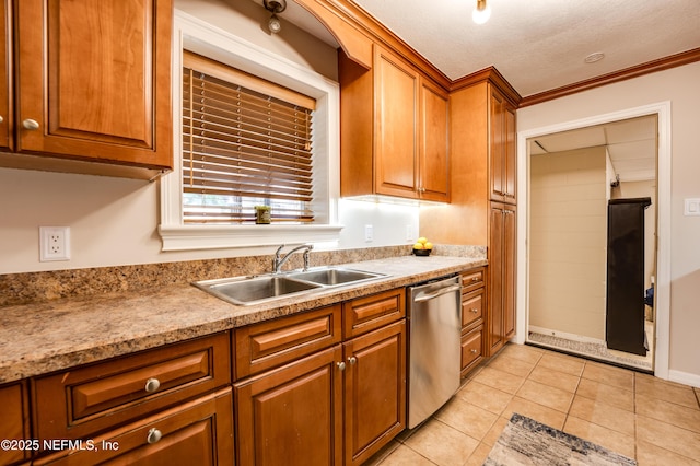 kitchen with dishwasher, crown molding, sink, light tile patterned floors, and a textured ceiling