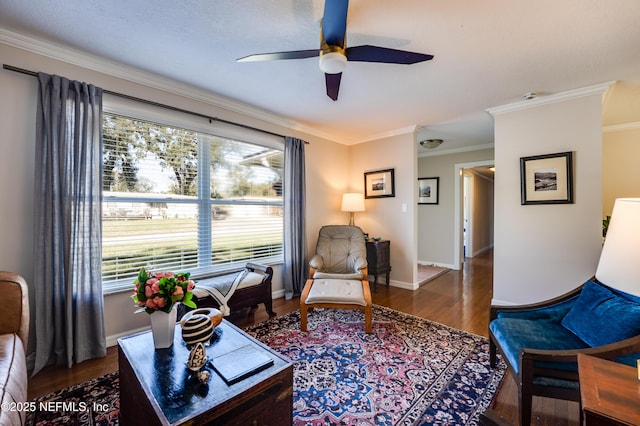 living room with ceiling fan, wood-type flooring, and crown molding