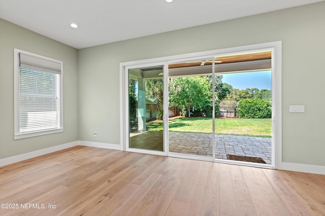 1021 6th Ave N, Jacksonville Beach, FL 32250 - spare room featuring baseboards, hardwood / wood-style floors, and recessed lighting