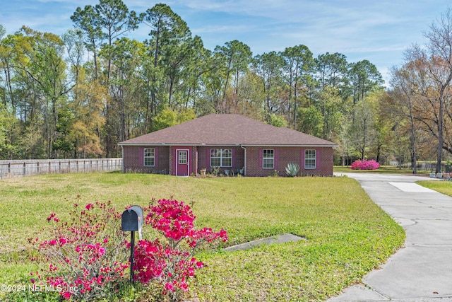 single story home featuring a front yard