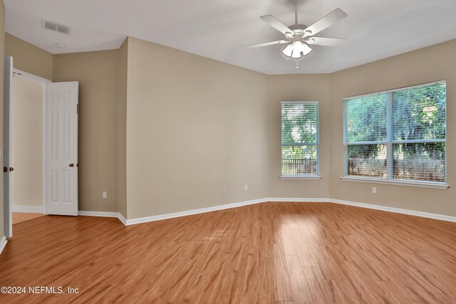 empty room featuring ceiling fan and light hardwood / wood-style floors