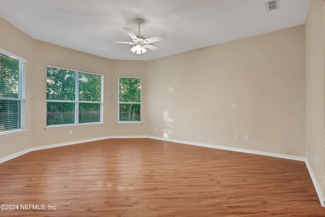 2176 Autumn Cove Cir, Fleming Island, FL 32003 - unfurnished room with light wood-style flooring and ceiling fan