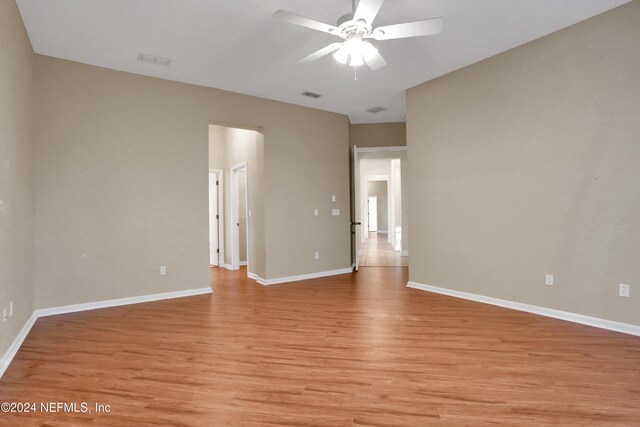 spare room featuring ceiling fan and light hardwood / wood-style flooring