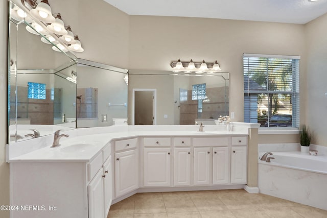 2176 Autumn Cove Cir, Fleming Island, FL 32003 - bathroom featuring double vanity, a bath, and tile patterned flooring