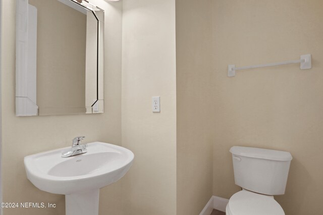 bathroom with toilet and sink