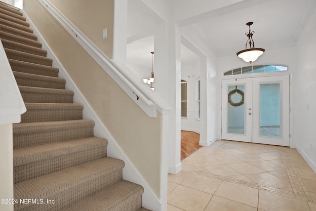2176 Autumn Cove Cir, Fleming Island, FL 32003 - entryway with stairway, light tile patterned flooring, and inlaid floor details