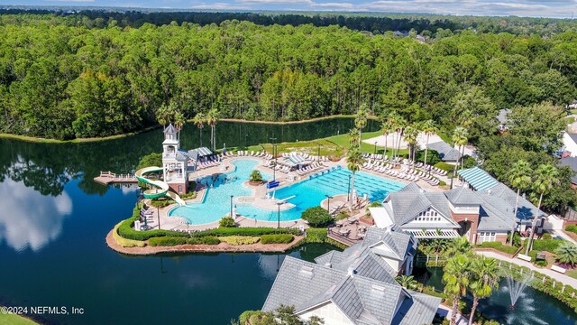 birds eye view of property with a water view