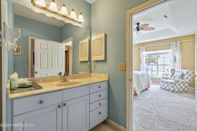 bathroom featuring ceiling fan and vanity