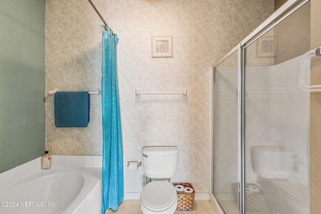 bathroom with tile patterned floors, separate shower and tub, and toilet