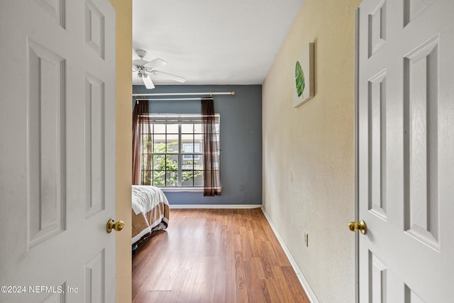 bedroom featuring ceiling fan and wood-type flooring