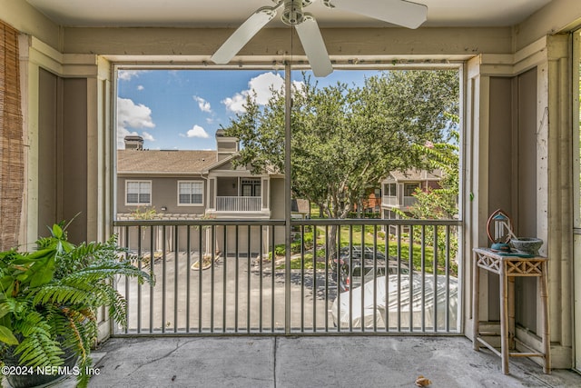 exterior space with ceiling fan