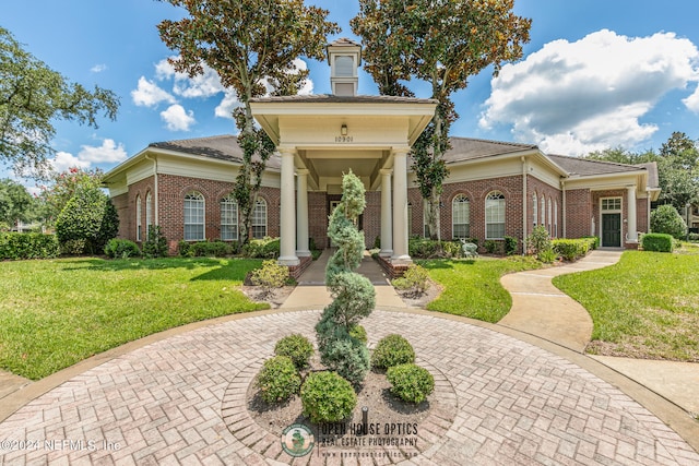 view of front of home with a front yard