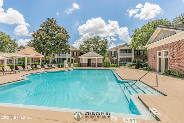 view of pool featuring a patio