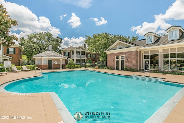 view of swimming pool with a patio area