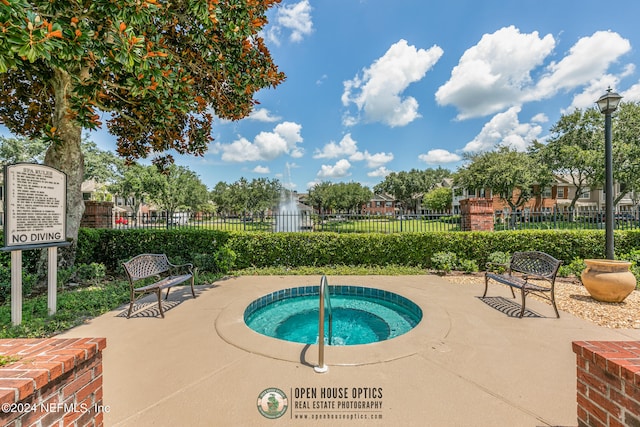 view of pool with a community hot tub