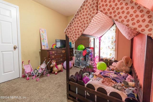 carpeted bedroom with a textured ceiling