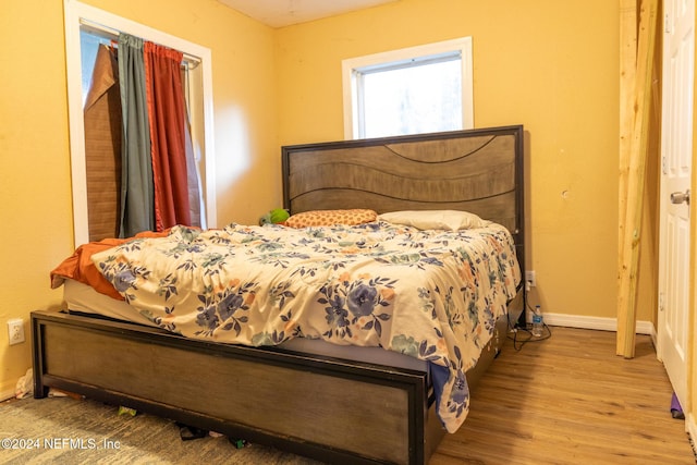 bedroom with hardwood / wood-style floors