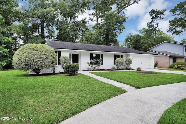 single story home with a front lawn and a garage