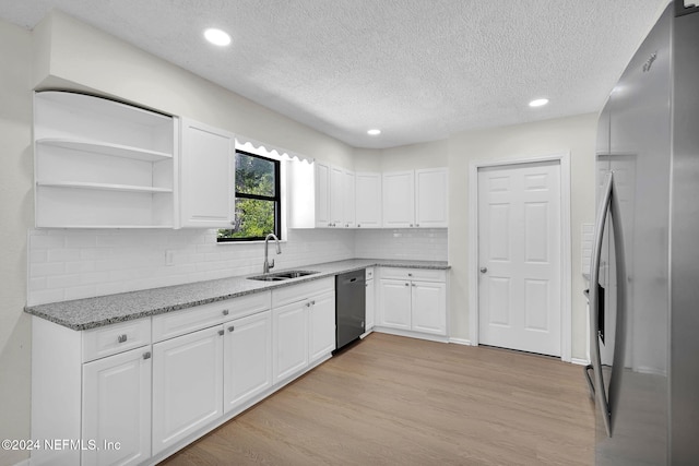 kitchen with stainless steel refrigerator, dishwasher, sink, light hardwood / wood-style flooring, and white cabinets