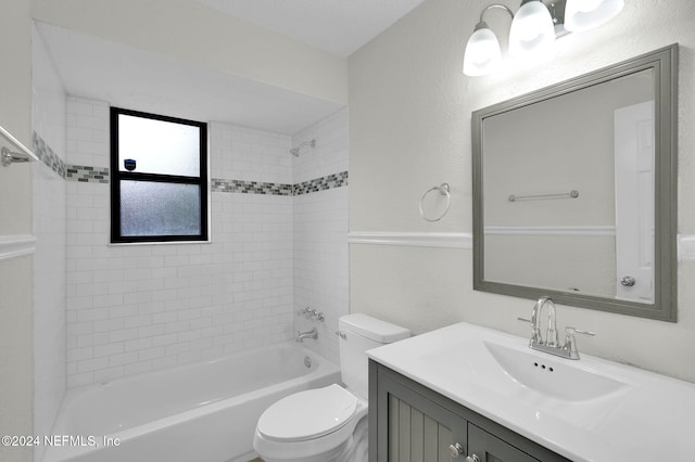 full bathroom featuring vanity, toilet, and tiled shower / bath combo