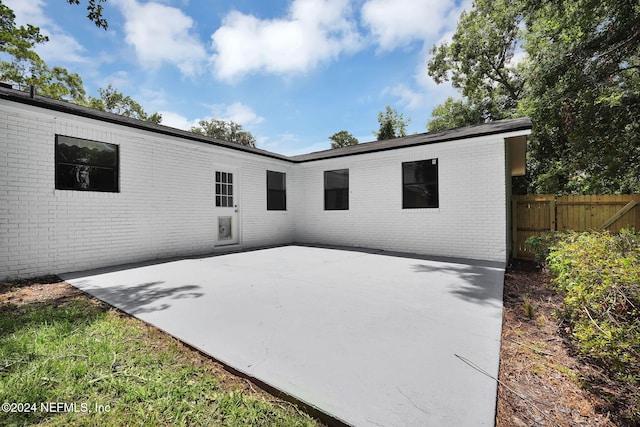 back of property featuring a patio area