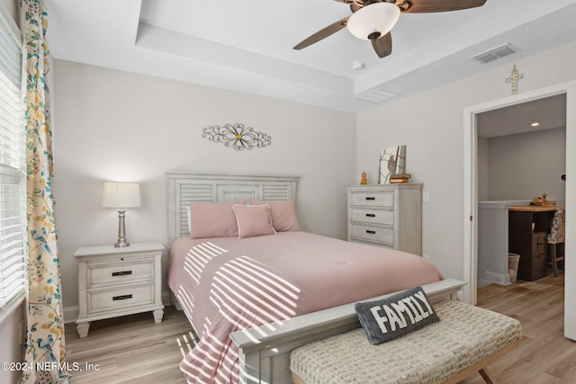 bedroom with light wood-type flooring and ceiling fan