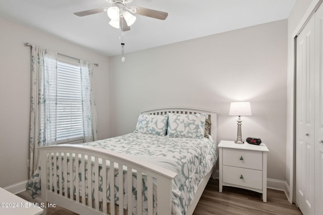 bedroom with hardwood / wood-style floors, a closet, and ceiling fan