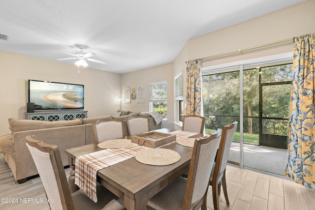 dining area featuring ceiling fan and light wood-type flooring