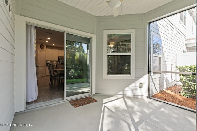 entrance to property with ceiling fan