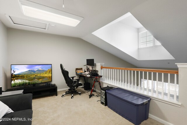 home office with light carpet and lofted ceiling