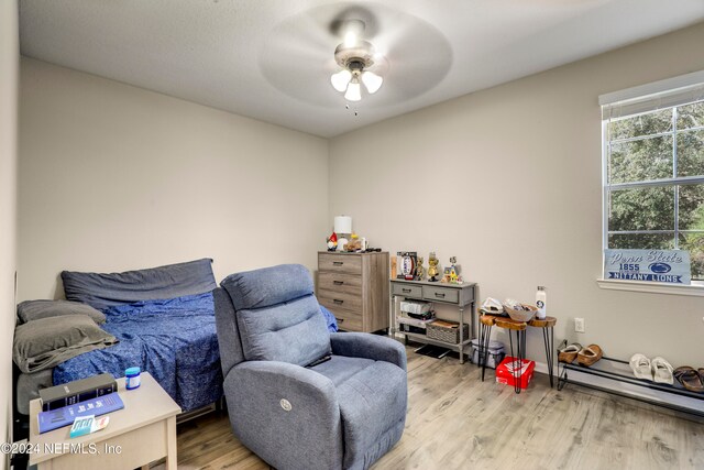 bedroom with ceiling fan and hardwood / wood-style floors