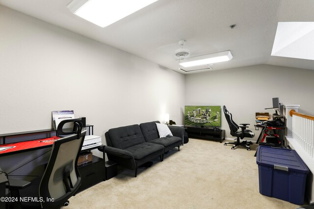 office area with light carpet, vaulted ceiling, and ceiling fan