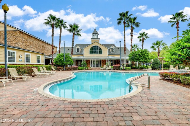 view of pool featuring a patio