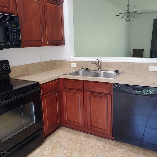 kitchen featuring black appliances, a notable chandelier, light tile patterned floors, and sink