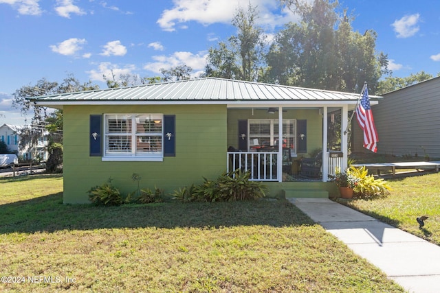 bungalow-style home with a front yard and a porch