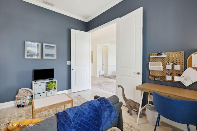 living room featuring light hardwood / wood-style floors and ornamental molding