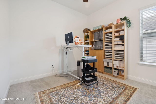 interior space featuring ceiling fan and carpet floors