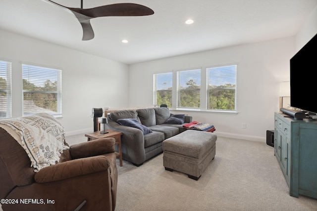 living room with light carpet and ceiling fan