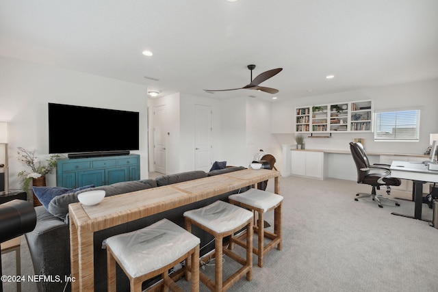 living room with light carpet and ceiling fan