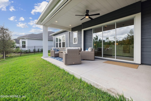 view of patio with ceiling fan and an outdoor living space