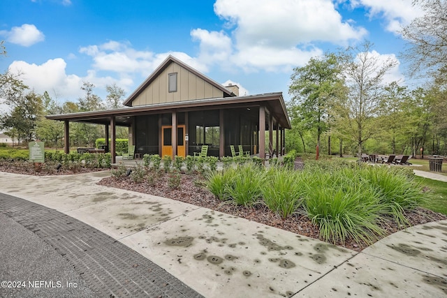 exterior space featuring a sunroom