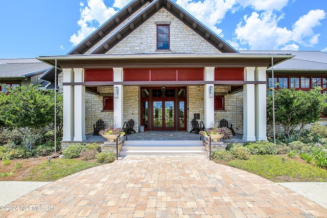 doorway to property with french doors and covered porch