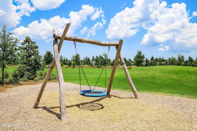 view of play area featuring a lawn