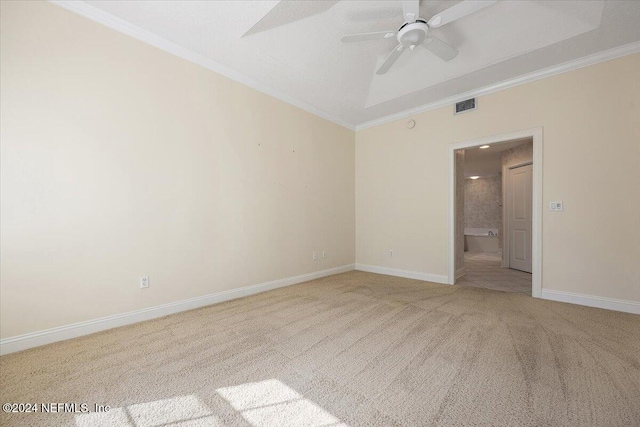 unfurnished room with light colored carpet, ceiling fan, and ornamental molding