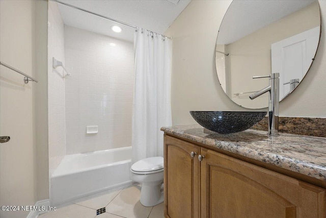 full bathroom featuring tile patterned floors, vanity, toilet, and shower / tub combo