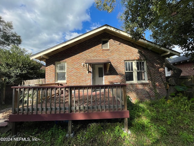 back of house featuring a deck