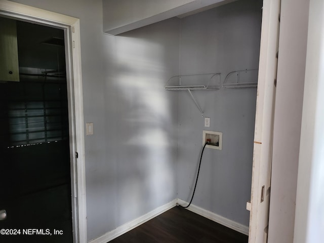 washroom featuring dark hardwood / wood-style floors and hookup for a washing machine