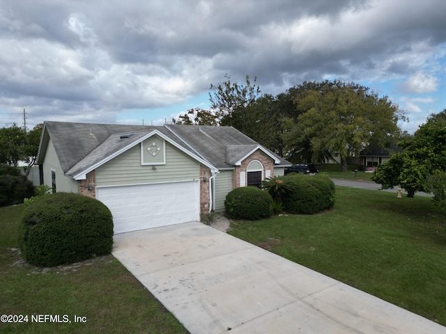 view of front facade with a garage and a front yard